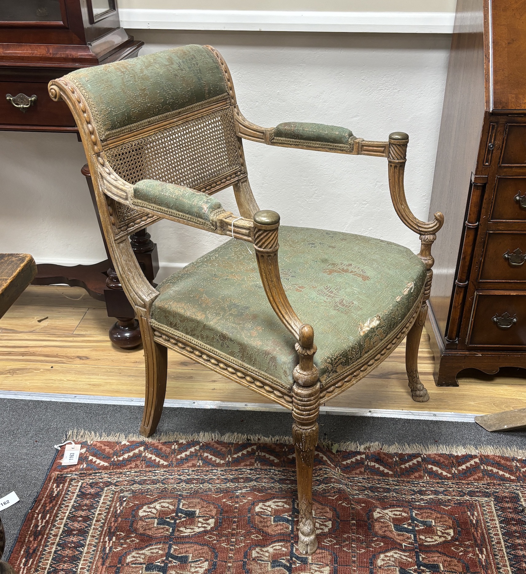 A 19th century oak and canework fauteuil, width 60cm, depth 50cm, height 86cm